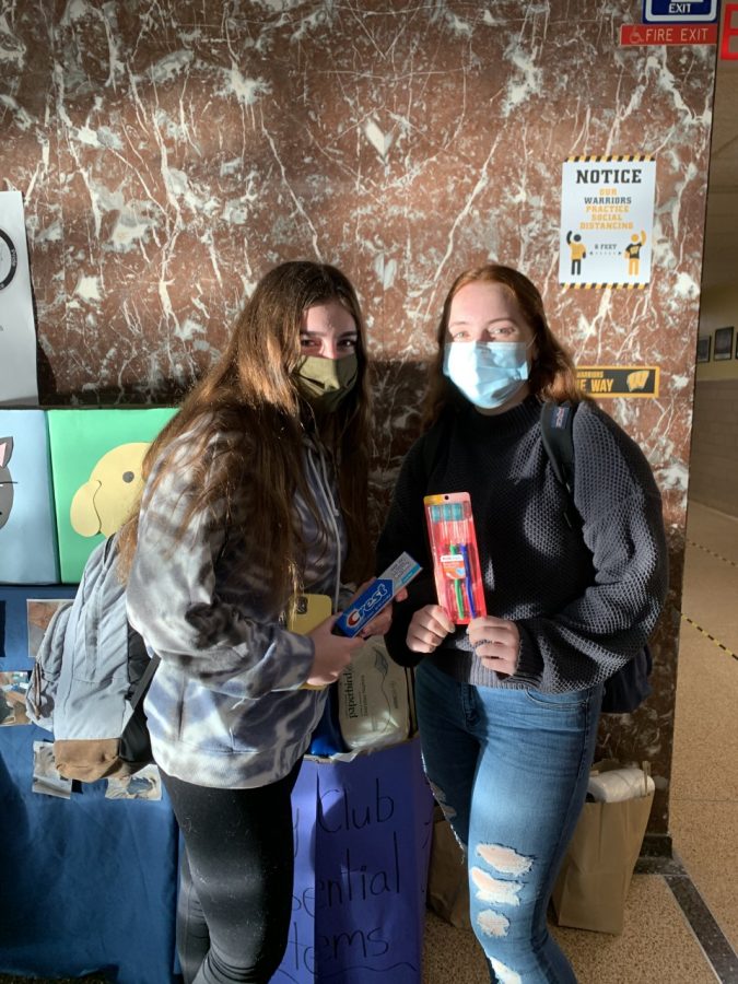 Haley Lerch and Julia Valentino are happy to participate in the Key Clubs Essential Items Drive. 